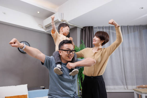 istock The young couple played at home with their son on their back 1396064383