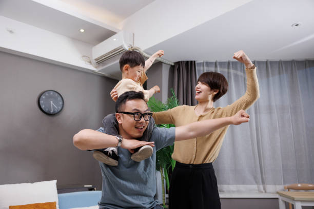 istock Father and son exercise together while mother refuel 1396064396