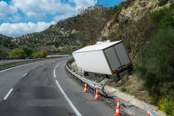 Refrigerated truck that has suffered an accident due to going off the road, leaving it off the road but without overturning. Refrigerated truck that has suffered an accident due to going off the road, leaving it off the road. hazard sign stock pictures, royalty-free photos & images