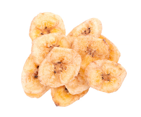 Banana chips isolated on white background. Dried fruit snack. Top view