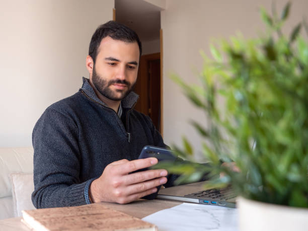 istock businessman working and talking in video conference with mobile phone 1396065395