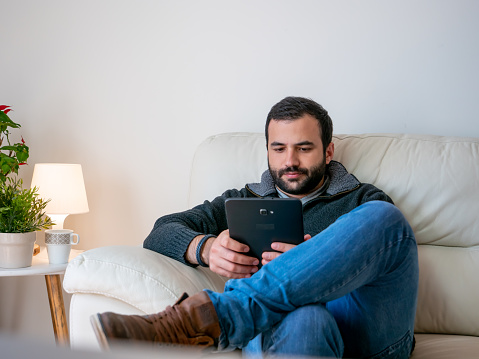 Concentrated man working remote at home
