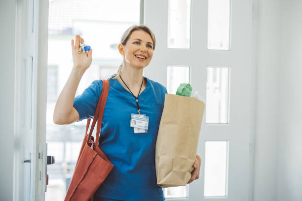 istock Female doctor coming home 1396066558