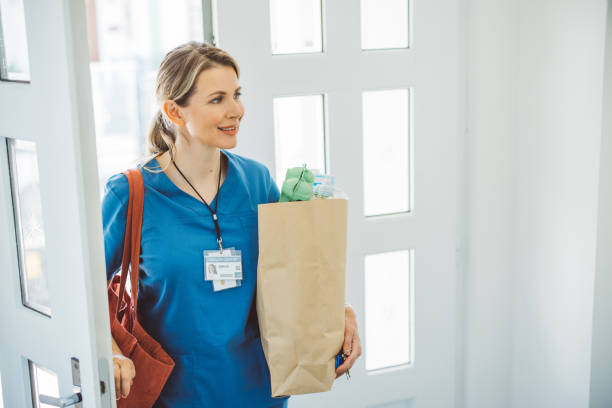 istock Female doctor coming home 1396066573