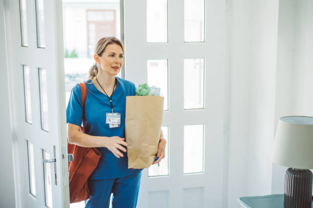 istock Female doctor coming home 1396066576