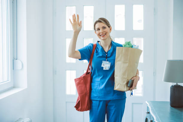 istock Female doctor coming home 1396066587