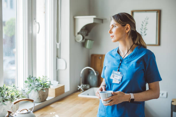 istock Female doctor at home 1396066609