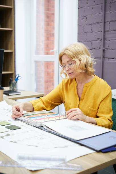 istock Designer examining colours in palette 1396069760