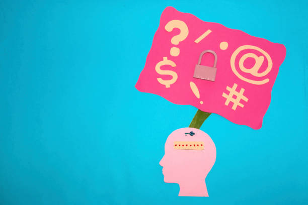 istock pink paper head with code and loops that make it strong, copy space on a blue background 1396070605