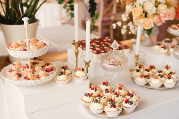 istock Candy bar with tasty desserts and appetizers at wedding reception. 1396071818