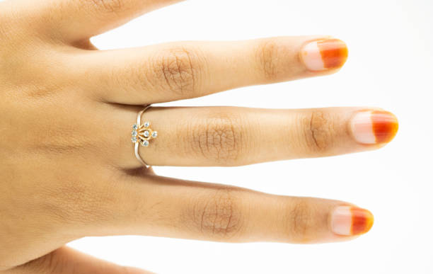 istock Close up of elegant diamond ring on white background. engagement ring 1396072289
