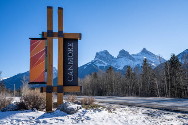 Canmore, Canada- November 20, 2016: Mountains surrounding Canmore, Alberta, and the own center. It is late afternoon in November with an unusual small amount of snow. People are, for the most part, residents.