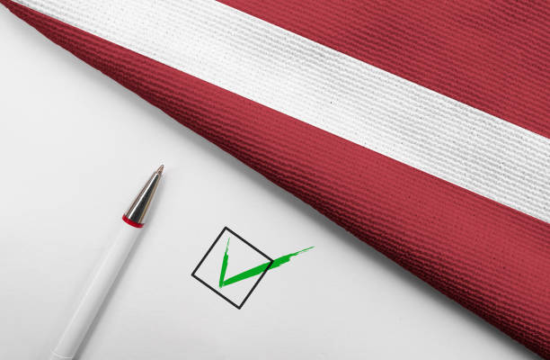 istock Flag of Latvia and check mark 1396074910
