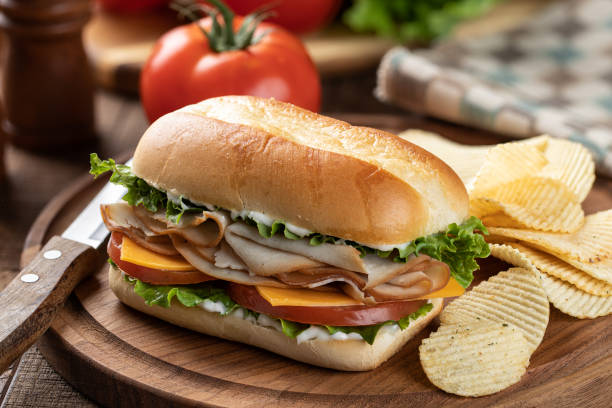 istock Turkey sandwich with lettuce cheese and tomato 1396074961