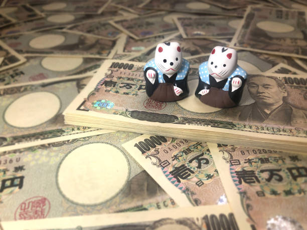 istock Big money and beckoning cat 1396078497