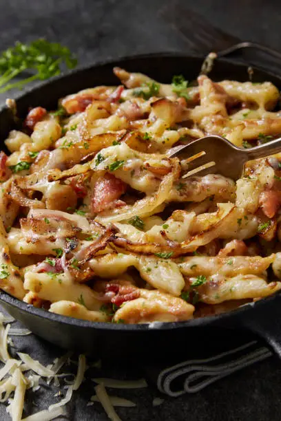 German Cheesy Fried Hand Made Spaetzle with Bacon and Emmental Cheese