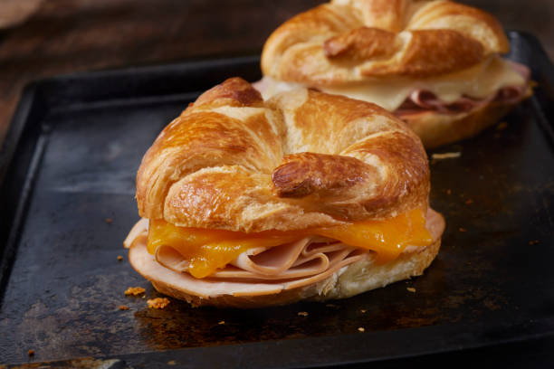 istock Baked Roast Turkey and Cheddar Cheese Croissant Sandwich 1396080070