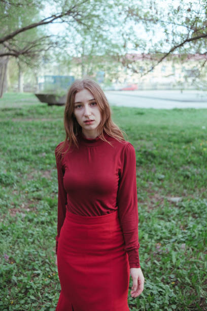 istock mysterious girl in red walking through the forest 1396080799