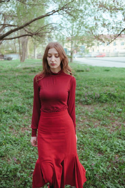 istock mysterious girl in red walking through the forest 1396080801
