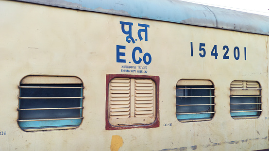 Pune, India - October 22 2023: Passenger train hauled by a WAP7 electric locomotive near Pune India.