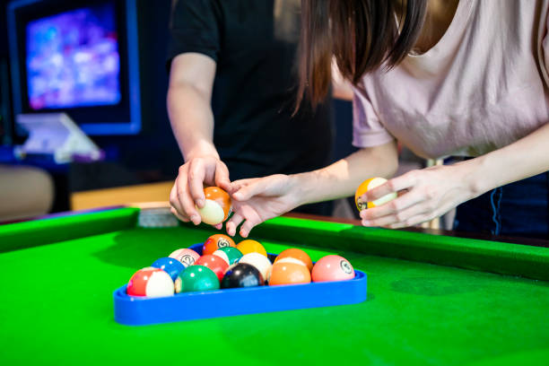 istock The hands that play billiards and arrange billiards in a pool hall 1396081673