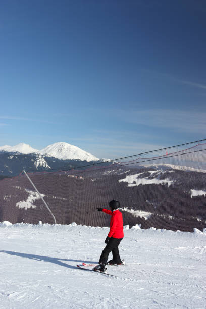 Perfect prepared fresh ski slope and ski lift on sunny  ski resorts.  Winter sport, ski resort, background   White snow and blue clear sky. Snowcapped mountain   landscape, Dolomite super ski area. Ski resort. Sellaronda, italy, Europe