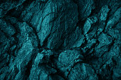 istock Green blue rock texture. Toned rough mountain surface texture. Crumbled. Close-up. 1396083727
