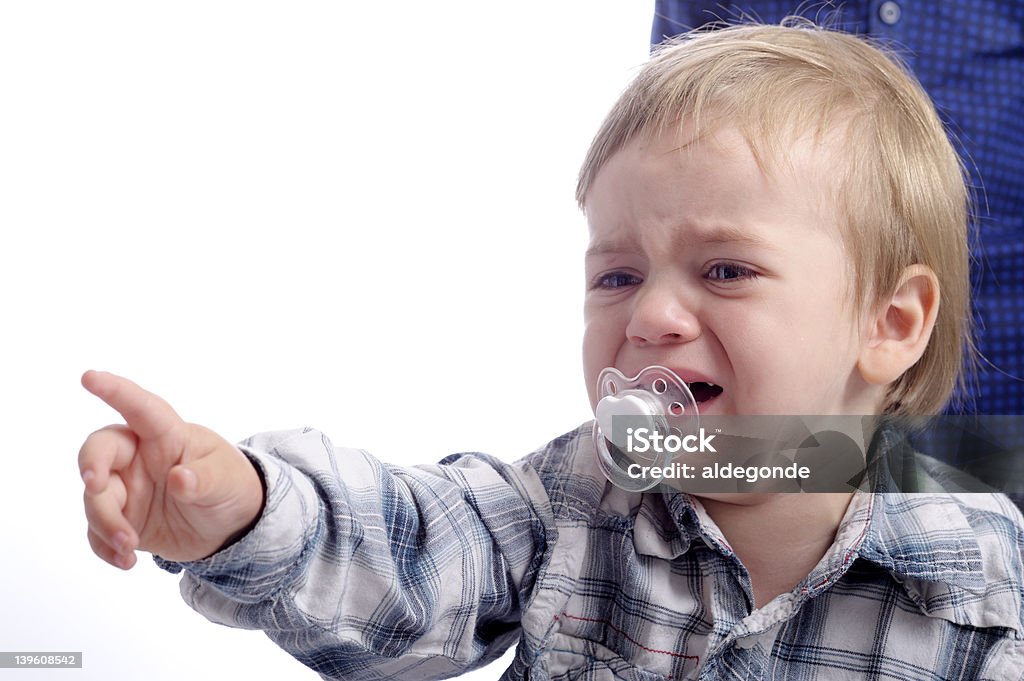 little crying child little crying child pointing with his finger 2-3 Years Stock Photo