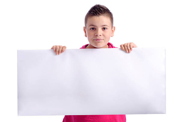 istock cute boy of 10 years with ad board 139608647