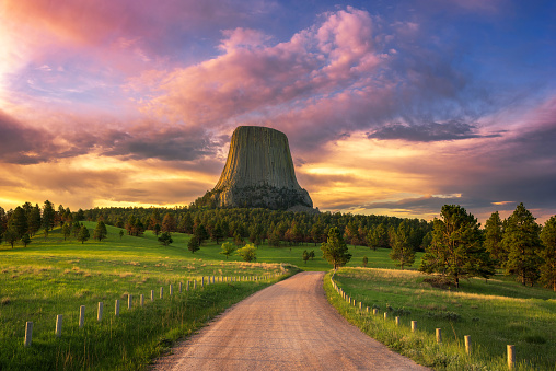 A colorful summer sunrise over Devils Tower National Monument