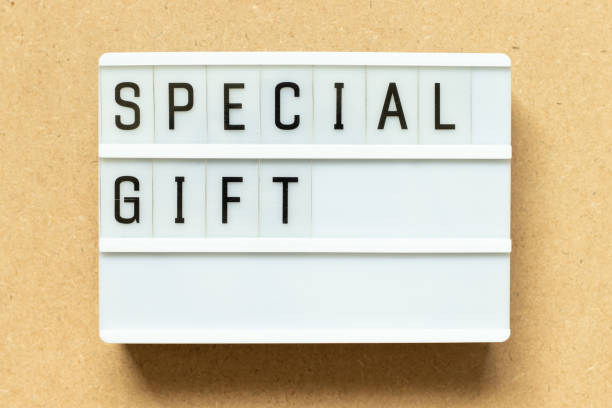 istock Lightbox with word special gift on wood background 1396086733