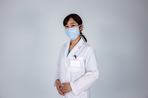 Studio shot of female doctor/nurse with white background