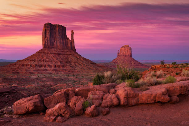 Twilight sky over the iconic Mittens in Monument Valley stock photo