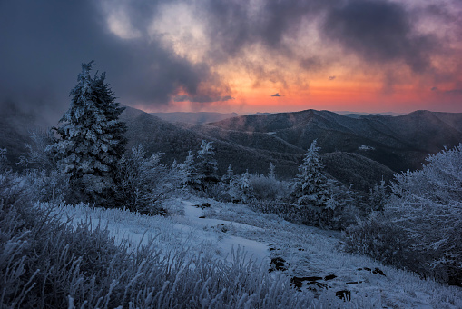 Sunrise over a snow covered landscape from along the Appalachian Trail near Carvers Gap in Tennessee
