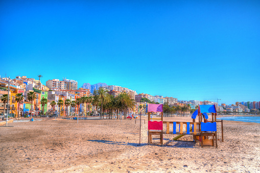Villajoyosa Spain beautiful beach with children`s play area Costa Blanca Alicante blue sky hdr