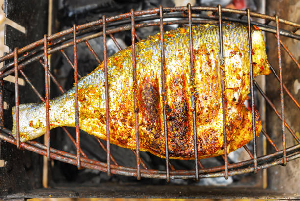 Grilled fish on the grill, cooked on fire, barbecue