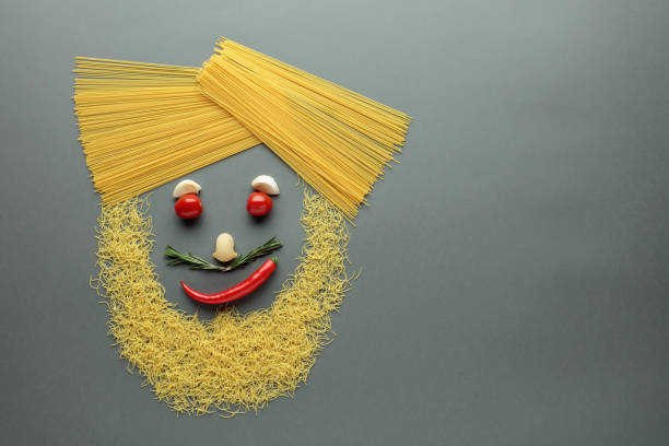 Funny portrait of a chef. Using ingredients for making pasta. Copy space.
