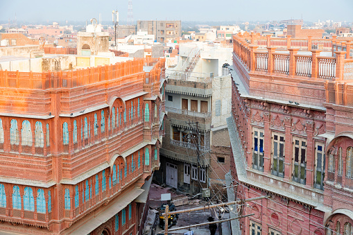 Elevated view of colorfully painted houses in old town of Bikaner, Rajasthan, Northern India.