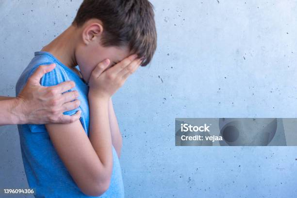 Mother Hand Hugging Sad Boy Learning Difficulties Family Problems Bullying Depression Stress Or Frustration Concept Stock Photo - Download Image Now