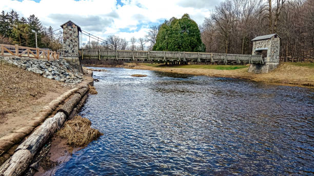 istock Spring day at the park with blue sky and open river 1396098138