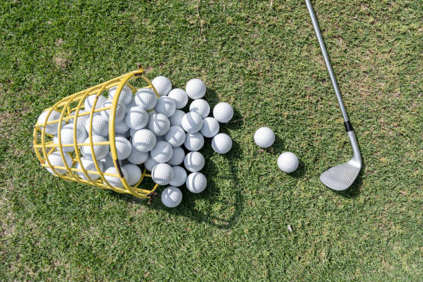 istock Looking down at the golf balls on the grass 1396098524
