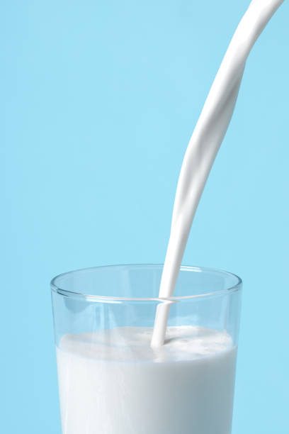istock Milk pours into the glass 1396101220