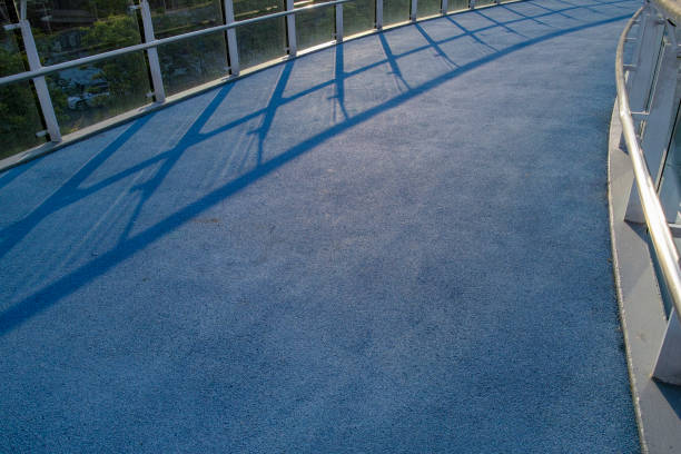 The shadow of the railing remains on the blue runway