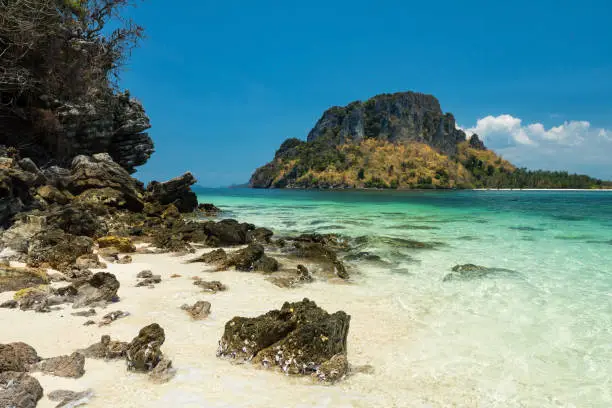 Beautiful seascape with natural stonearch at separated sea or thale waek in sunny day at Krabi, Thailand. Famous travel destination or holiday maker in tropical country, Siam.