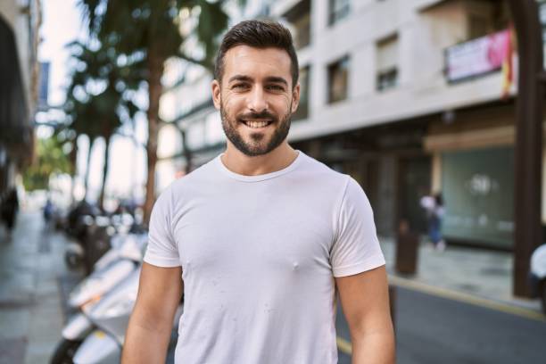 istock Young hispanic man smiling confident walking at street 1396105090