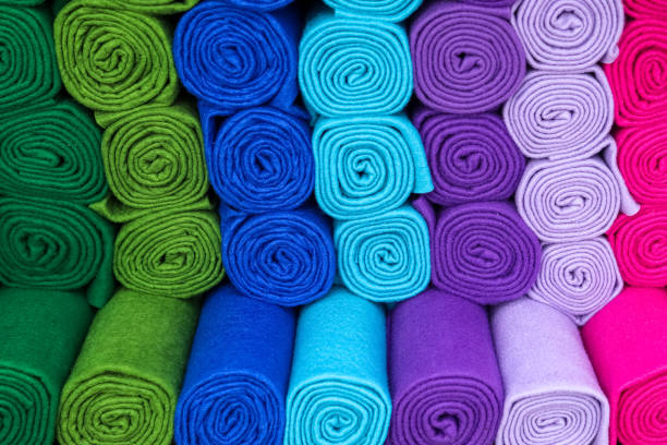 istock Samples of cloth and fabrics in different colors found at a fabrics market. 1396105390