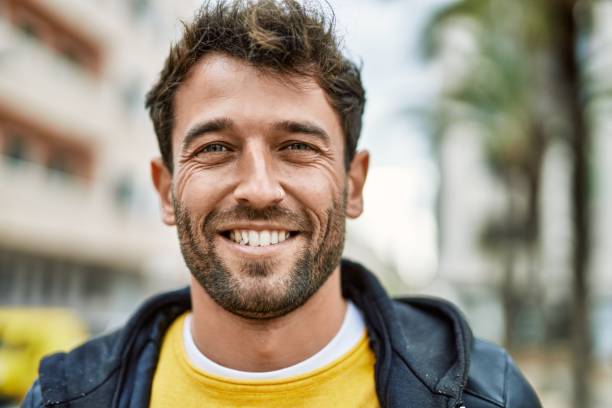 istock Handsome hispanic man with beard smiling happy outdoors 1396106613