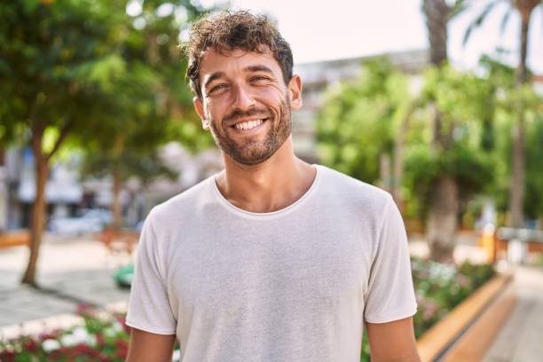 istock Young hispanic man smiling confident walking at park 1396107168