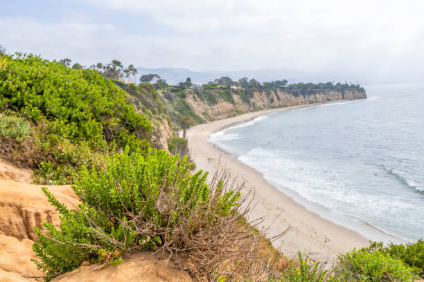 istock View from on top of cliffs on a sandy beach 1396109183