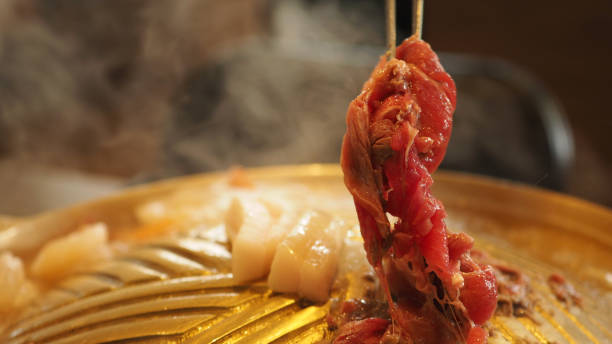 istock Thai BBQ or Yakiniku.It is meats, cooked on brass barbecue pan. 1396110745